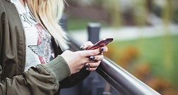 Woman Holding a Mobile Phone