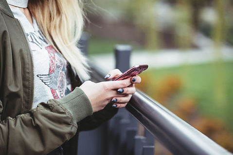 Woman Holding a Mobile Phone