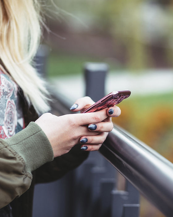 Woman Holding a Mobile Phone