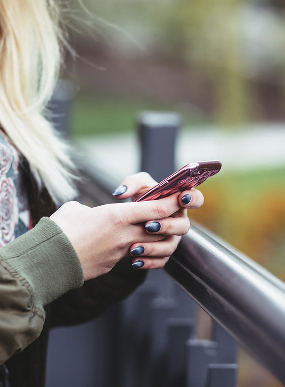 Woman Holding a Mobile Phone