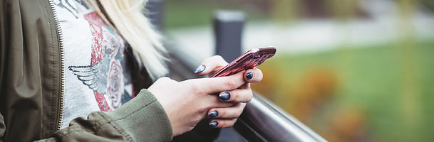 Woman Holding a Mobile Phone