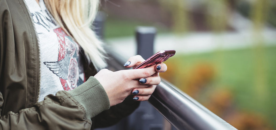 Woman Holding a Mobile Phone