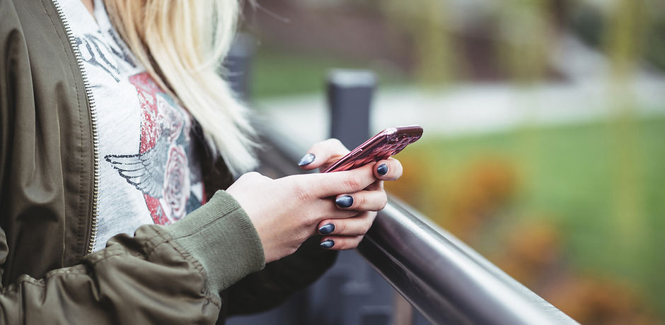 Woman Holding a Mobile Phone