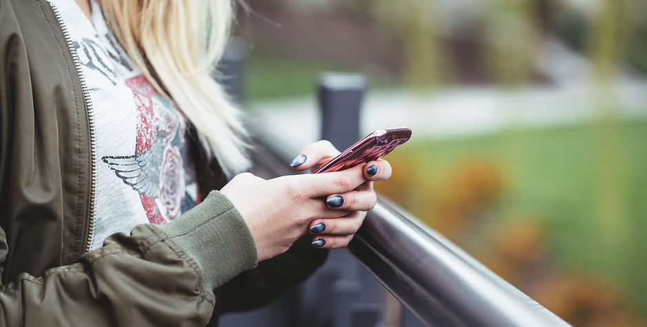 Woman Holding a Mobile Phone