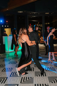 Wedding guests dancing and celebrating during the reception.