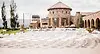 Outdoor wedding ceremony setup at Flying Horse Resort & Club in Colorado Springs, Colorado, featuring white ceremony seating, stone architecture, mountain views, and luxury resort surroundings.