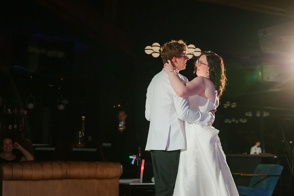 Evelyn and Charles sharing their first dance during their wedding reception at The Oaks at Plum Creek in Castle Rock, Colorado.