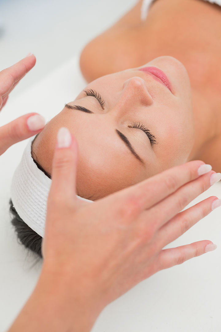 peaceful-brunette-getting-reiki-therapy.jpg