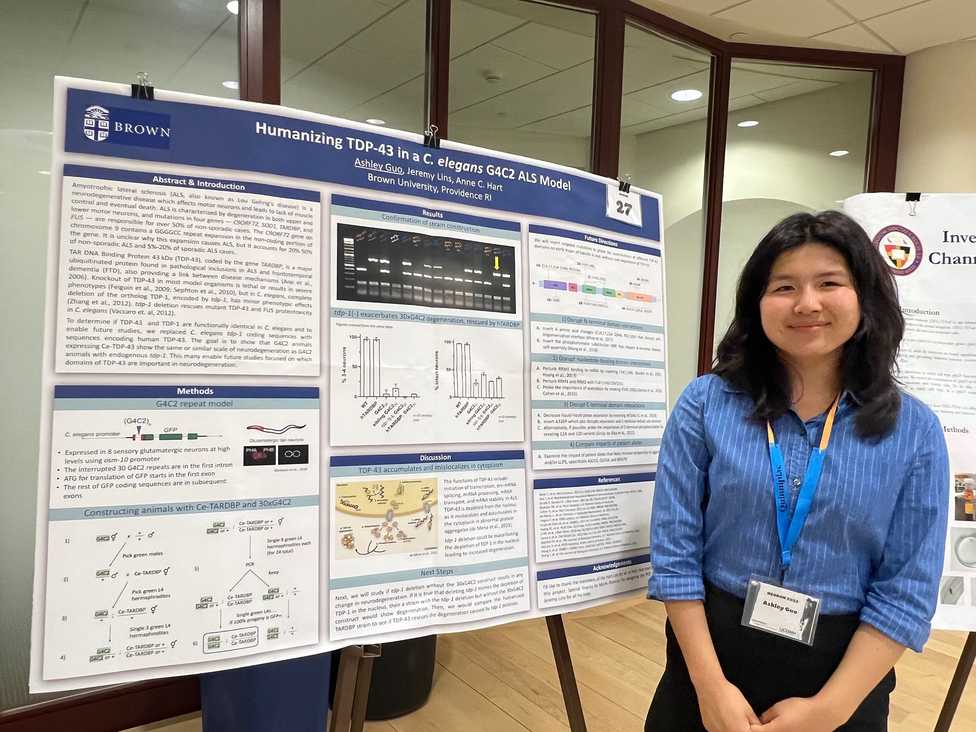 Woman presents poster.