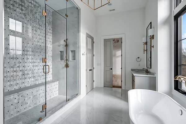 New construtions master bathroom. white marble titling. marble backsplash