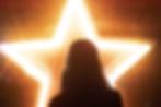 woman facing a bright star