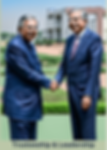 Image of a trustee shaking hands with the leadership member of an Organization