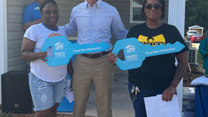 Greenville business leaders help two families build new homes