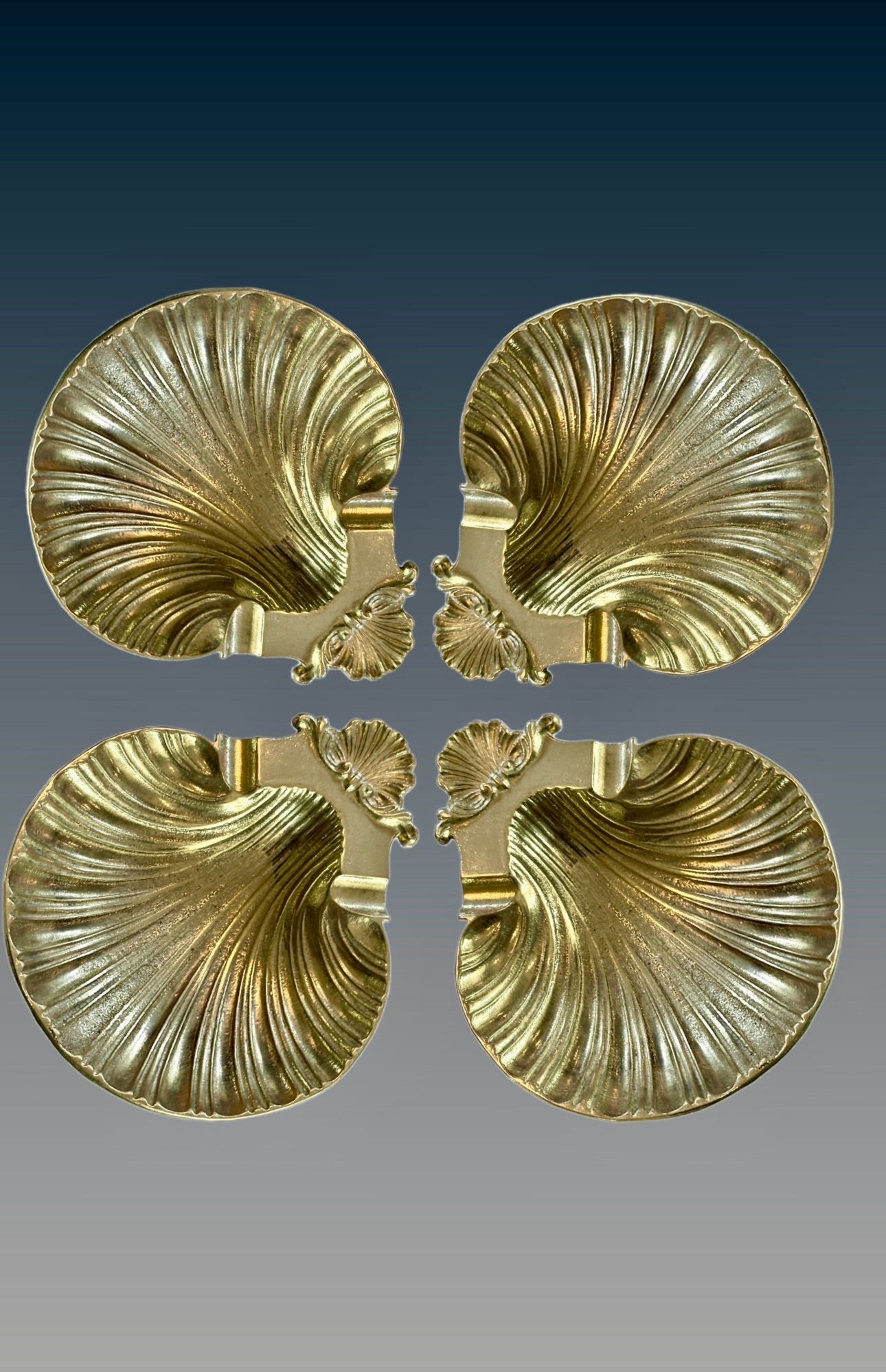 Set of Four Brass, footed clamshell holders/ashtrays