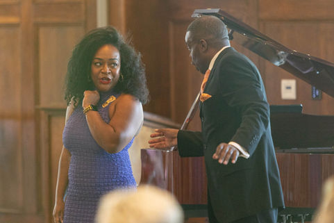 male and female signers performing a playful duet