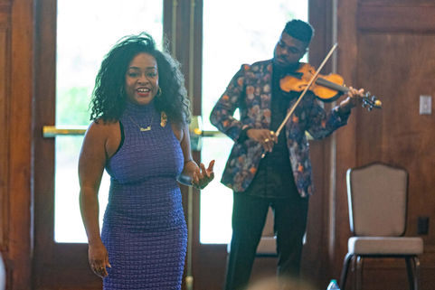 singer and violinist performing together