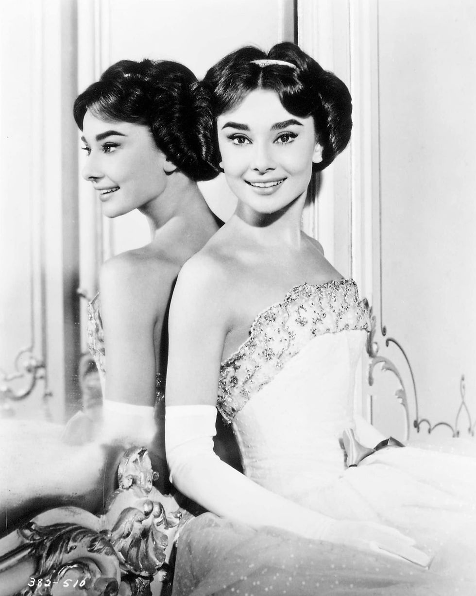 Picture description: "Audrey Hepburn in ''Love in the Afternoon'' (1957) - WorthPoint, Public domain, via Wikimedia Commons.