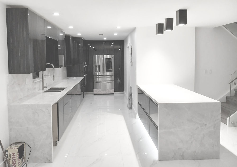 Luxury custom made kitchen with dark cabinets, large island