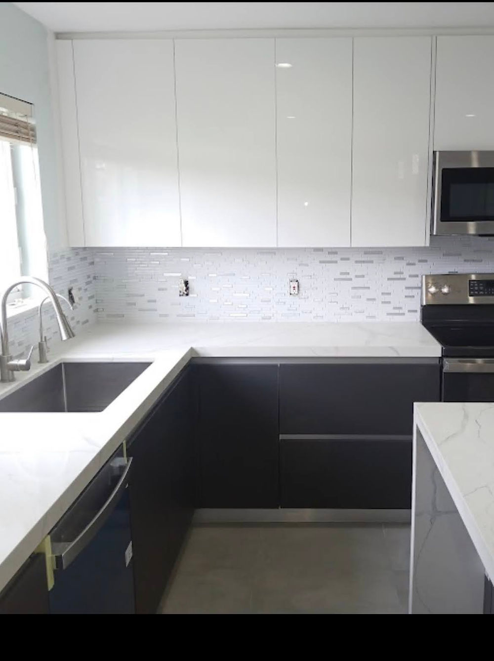 Luxury custom kitchen with white and dark cabinets