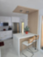 Luxury custom made kitchen with white cabinetry and island
