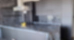 Luxury custom kitchen, dark cabinets, chevron backsplash