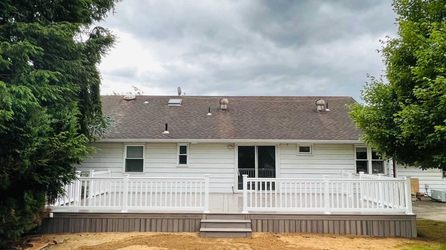 Straight view of new deck with railing and stairs