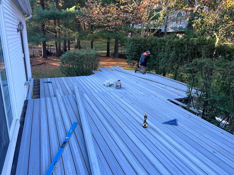 Backyard deck under construction at a residential property.