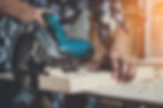 Close-up of a carpenter using a circular saw to cut wood, showcasing the hands-on craftsmanship and precision in carpentry work. The image highlights the practical application of Peddyl CRM for carpentry contractors.