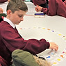 Child sorting educational cards