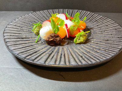 New dish coming soon Burrata tomato salad with homemade pesto, tapenade drizzled with extra virgin olive oil