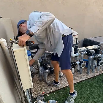 Owner and Operator Jeff Gaspar works on pool pump and water treatment