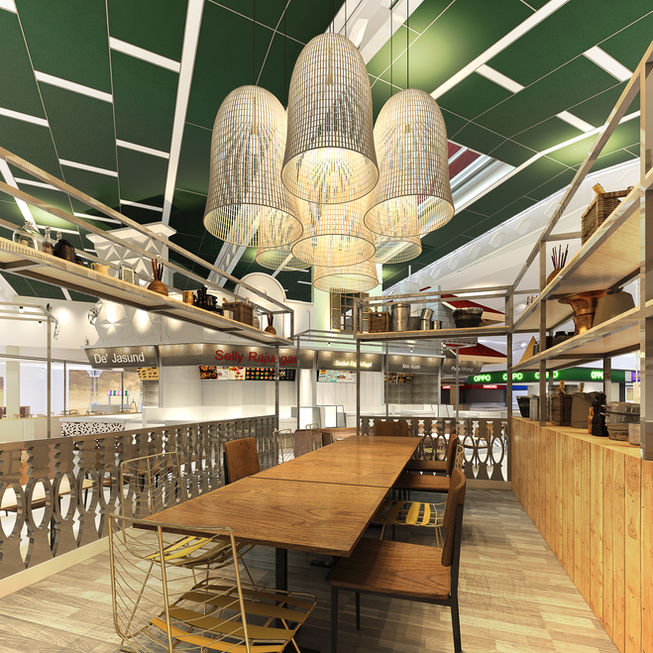 Communal dining lounge featuring a long wooden table, matching chairs, oversized woven basket lamps hanging from the ceiling, and wooden shelving units.
