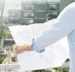 Architect hold plans