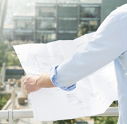 Architect hold plans