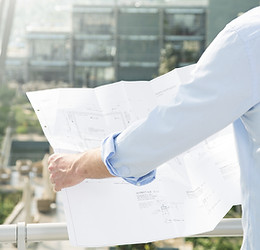 Architect hold plans