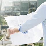 Architect hold plans