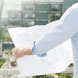 Architect hold plans