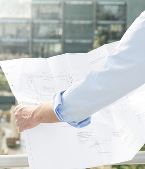 Architect hold plans