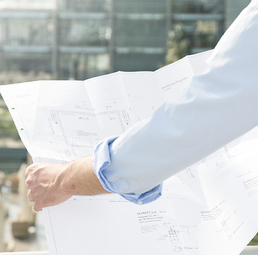 Architect Reviewing Blueprint