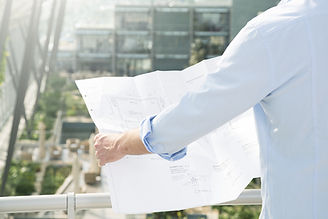 Architect hold plans