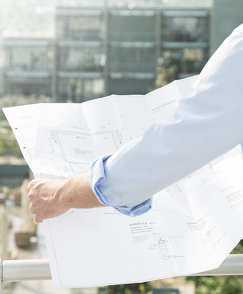 Architect hold plans