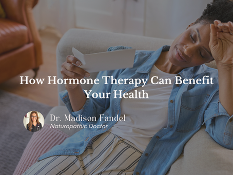 A woman sitting on a couch fanning herself with a piece of paper with text that reads, "How Hormone Therapy Can Benefit Your Health: From a Naturopathic Doctor" Written by Dr. Madison Fandel, Naturopathic Doctor with a photo of Dr. Madison Fandel