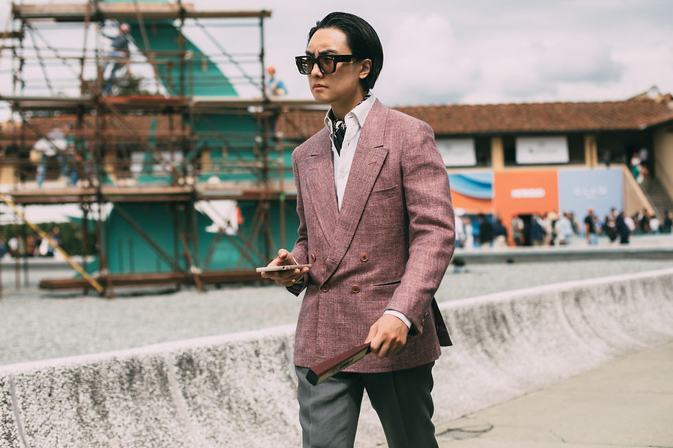 Pitti Uomo 104 Day 2 Outfit. Pink 4*1 Double-breasted jacket with ivory linen shirt, steel grey linen trousers, and black-and-white silk scarf. Glasses are the Enxo model from Jacques Marie Mage (JMM).