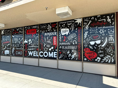 Window full of little art graphics and 'Welcome' in different languages.