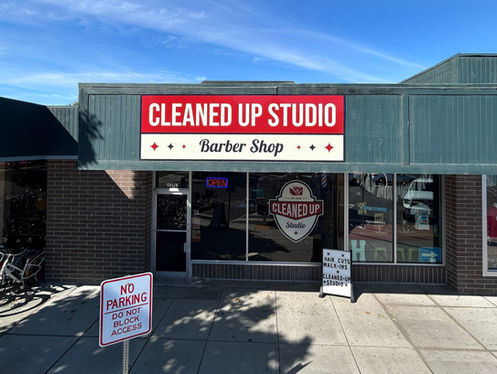 A store front with a sign.