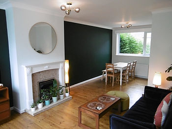 Leeds painters and decorators dream living dining room for client with dark green feature alcoves and varnished wooden floorboards