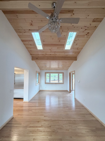 Home Addition hard wood floors and vaulted ceiling
