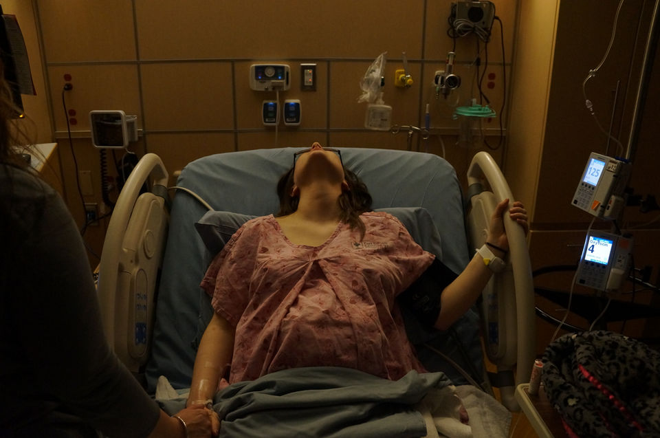 Mother laboring in hospital.