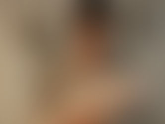 New parent holding a swaddled newborn and looking overwhelmed, illustrating the emotional impact of perinatal ADHD and postpartum depression risk.