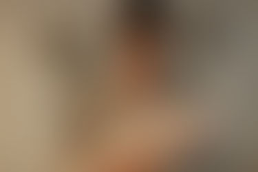 New parent holding a swaddled newborn and looking overwhelmed, illustrating the emotional impact of perinatal ADHD and postpartum depression risk.